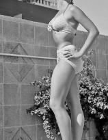 Yvonne Craig - young model pose by the pool