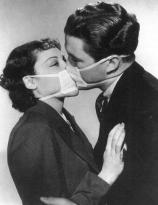 Couple kissing with surgical masks to prevent infection during a flu epidemic, 1937