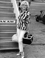 Marilyn Monroe boarding a flight at Miami International Airport on her way to Mexico on February 21, 1962