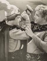 Buster Crabbe, right, in a publicity still for the 1938 serial Flash Gordon’s Trip to Mars