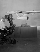 VFX wizard Linwood Dunn sets up a shot of the eleven-foot studio model of Star Trek Starship Enterprise
