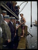 Harry Houdini steps into a crate at New York Harbor as part of an escape stunt, July 7, 1912