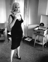 Marilyn Monroe listening to records